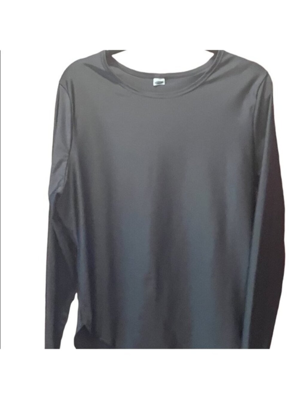 woman’s black, long sleeve,‎ athletic top
